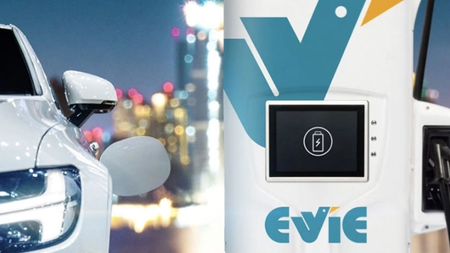 Electric vehicle charging at an Evie Networks fast charger in an urban setting