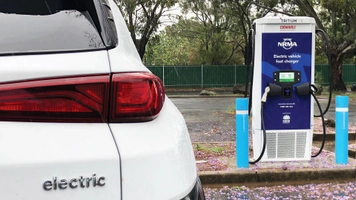 Electric vehicle charging at NRMA fast charger station in NSW