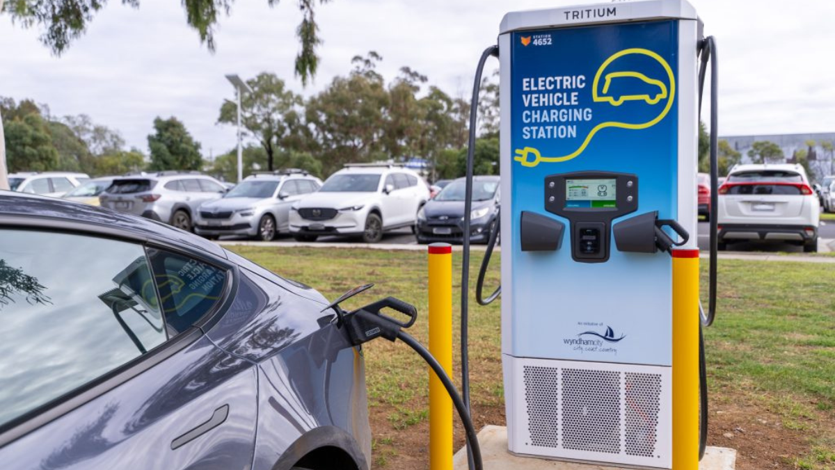 Electric car connected to a smart EV charging station in an Australian car park
